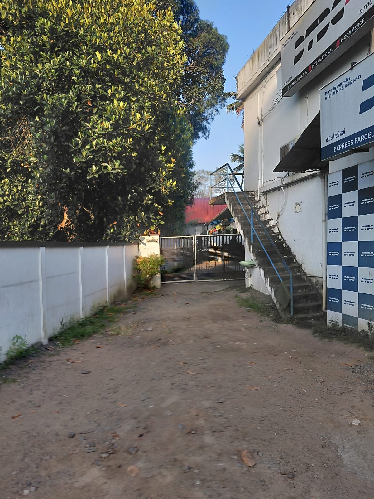 Property for Sale in Edappally: 11.25 Cents of Land with a House and a Commercial Building (7 Shop Units)