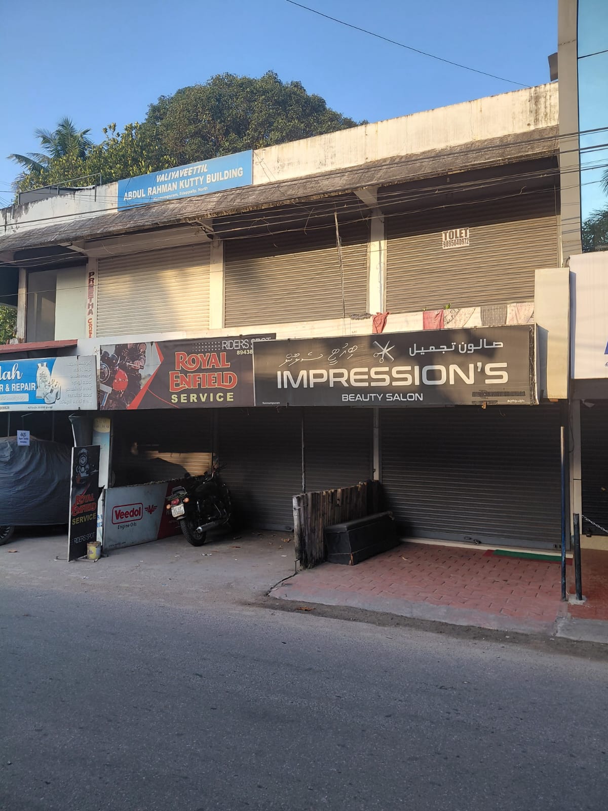 Property for Sale in Edappally: 11.25 Cents of Land with a House and a Commercial Building (7 Shop Units)